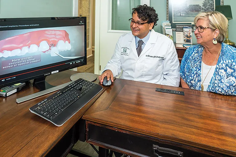 Image of Dr. Bhasin in a consultation with a patient.